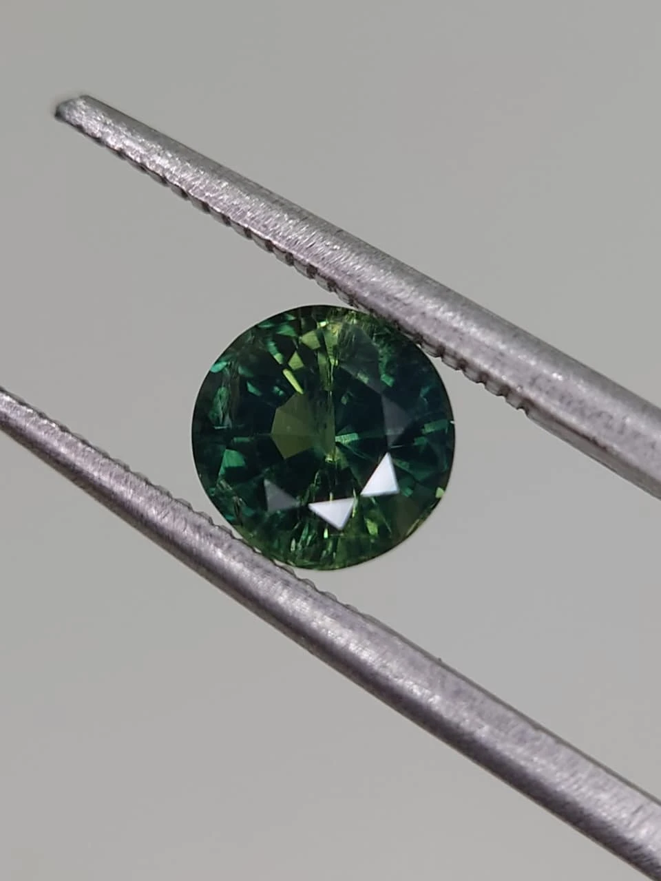 1.3ct Bluish Green Natural Round Faceted Sapphire from Nigeria — view 6